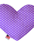 Heart shaped squeaker dog toy. Purple background with white polka dots. Made in USA label on bottom trim.
