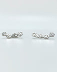 Sterling silver paw print climber earrings in silver.