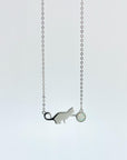 Sterling silver necklace with cat and opal charm.