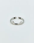 Sterling silver band ring with cat ears and hidden paw prints.