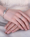 Sterling silver band ring with cat ears and hidden paw prints (worn by model).