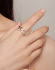 Sterling silver infinity cat ring with cubic zirconia gemstones in a pave setting (worn by model).