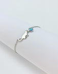 Sterling silver bracelet with cat and opal charm.