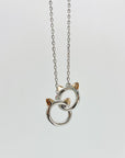 Sterling silver cat infinity necklace. Features two cat head charms that are linked.
