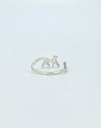 Sterling silver ring in the shape of a cat walking. Open, adjustable band.