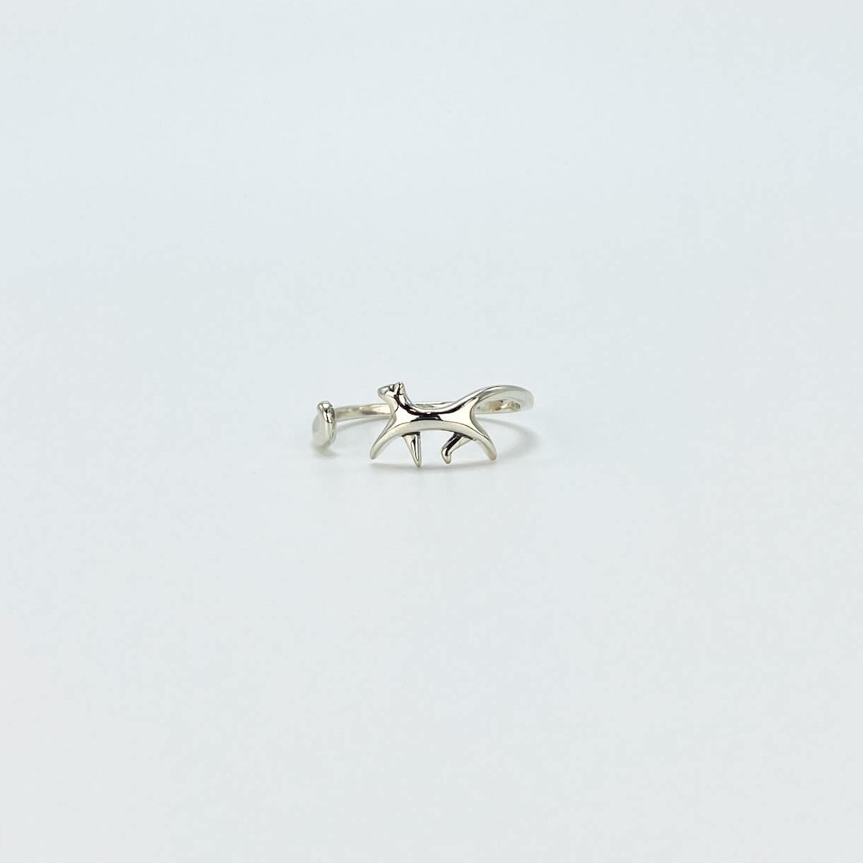 Sterling silver ring in the shape of a cat walking. Open, adjustable band.