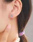 Sterling silver paw earring studs with cubic zirconia gemstones (worn by model).