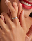 Sterling silver band ring with enameled paw prints (worn by model).