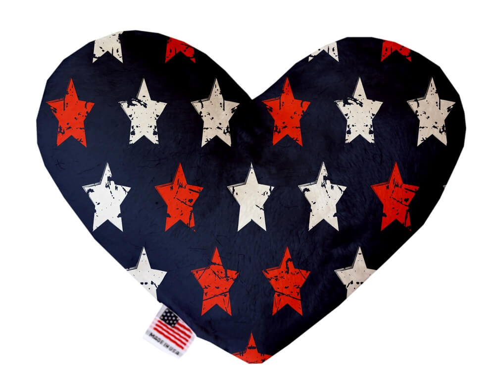 Patriotic, 4th of July themed heart shaped squeaker dog toy. Navy blue background with stamped red and white stars. Made in USA label on bottom trim.