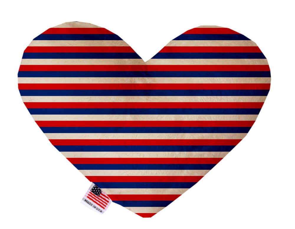 Patriotic, 4th of July themed heart shaped squeaker dog toy. Red, white and blue striped print. Made in USA label on bottom trim.