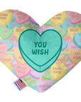 Heart shaped squeaker dog toy. Multicolored Valentine's Day candy heart background with 'You Wish' heart in the center. Made in USA label on bottom trim.