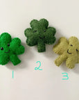 Three wool shamrock cat toys.