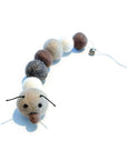 Organic wool caterpillar cat toy in neutral tones (brown, white, & charcoal). Has bell at the end of it's tail.