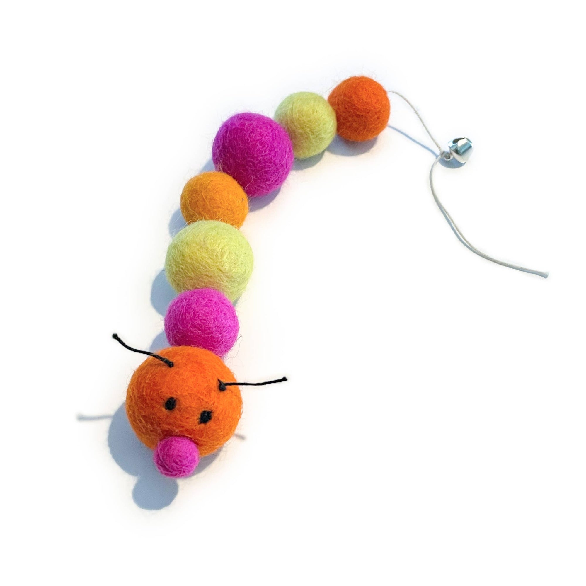 Organic wool caterpillar cat toy in vibrant tones (orange, hot pink & lemon yellow). Has bell at the end of its tail.