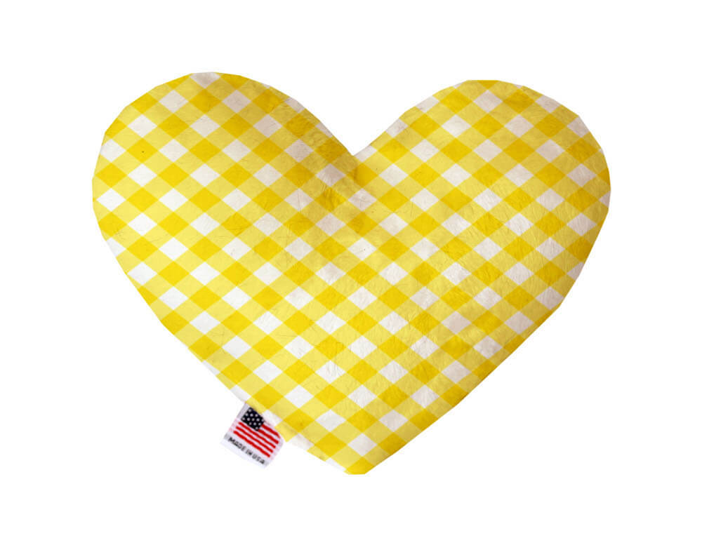 Heart shaped squeaker dog toy in a yellow and white gingham print. Made in USA label on bottom trim.