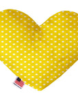 Heart shaped squeaker dog toy. Yellow background with white polka dots. Made in USA label on bottom trim.